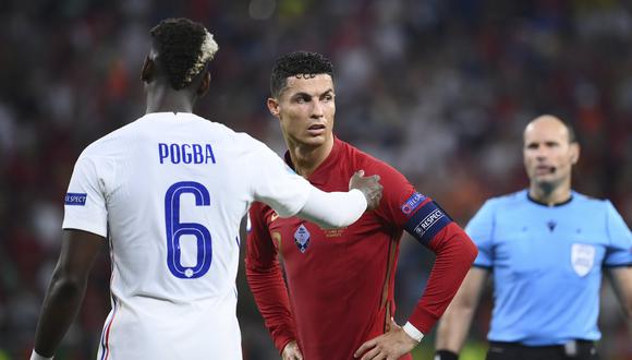 Paul Pogba y Cristiano Ronaldo podrían jugar juntos en PSG. (Foto: AP)